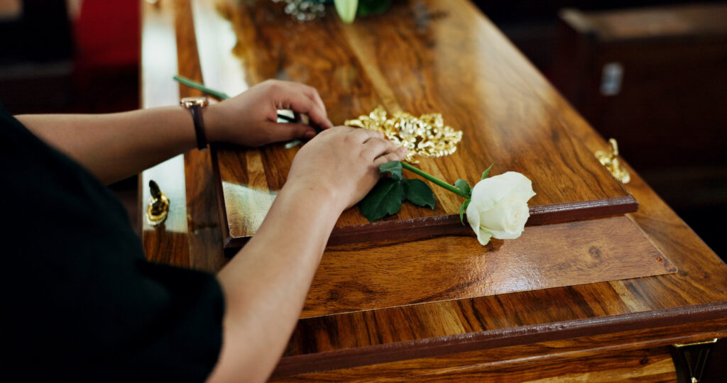 A TJM Frisco funeral director guiding a family